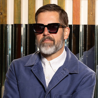 man wearing dark tortoiseshell sunglasses