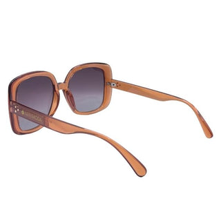 Sunglasses with orange frame and gradient lenses on a white background