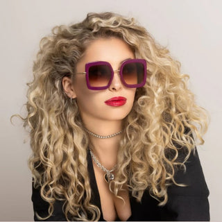 female wearing purple sunglasses