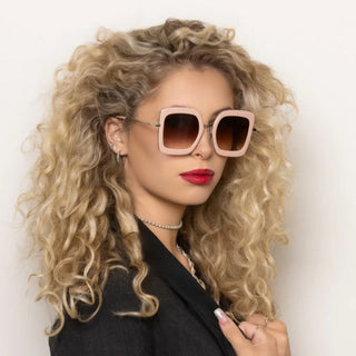 woman wearing large pink sunglasses