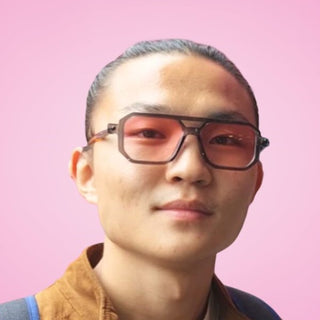 man wearing pink lens sunglasses