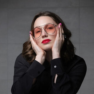 woman wearing silver framed with pink lens sunglasses