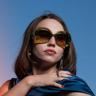model wearing green acetate sunglasses
