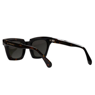 Sunglasses with tortoiseshell frame and dark lenses on a white background
