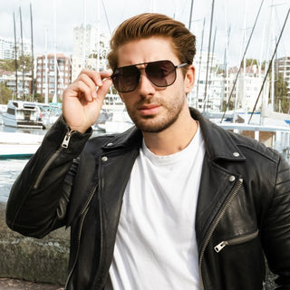 model wearing black aviators