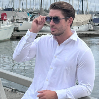 man at yacht club in blue sunglasses