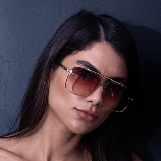 woman wearing gold double bridge sunglasses