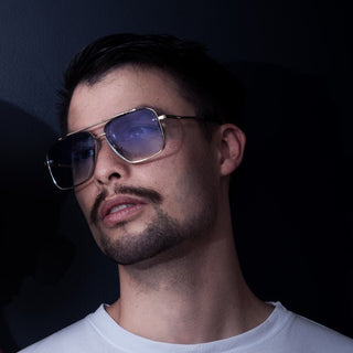 man wearing blue aviators