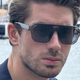 Man wearing grey sunglasses