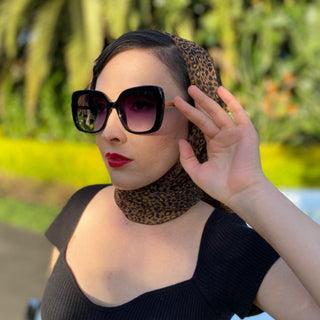 woman wearing oversized lack sunglasses