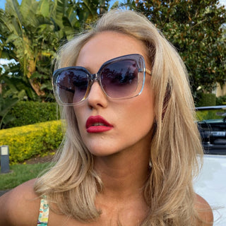 woman wearing oversized sunglasses