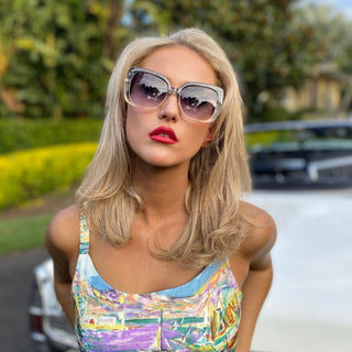 model wearing oversize sunglasses