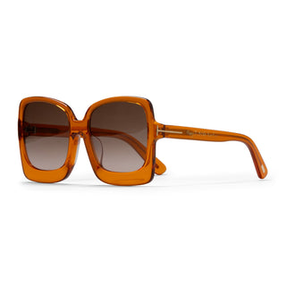 Orange sunglasses with brown gradient lenses on a white background