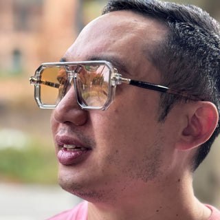 man wearing yellow ens sunglasses
