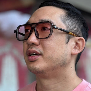 man with pin lens sunglasses