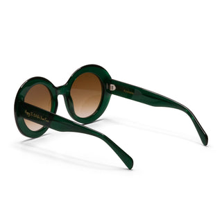 Green sunglasses with brown lenses on a white background