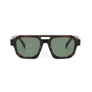 Sunglasses with tortoiseshell frame and green lenses on a white background