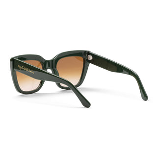 Green sunglasses with brown gradient lenses on a white background