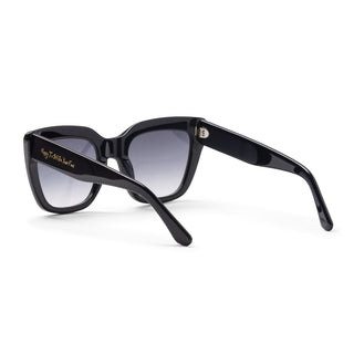 Dark blue sunglasses with gradient lenses on a white background