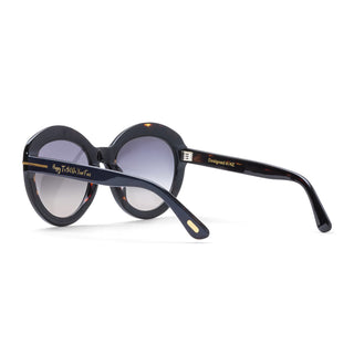 Sunglasses with dark blue frame and gold accents on a white background