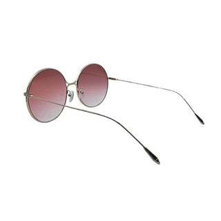 Round sunglasses with pink gradient lenses on a white background