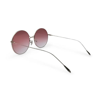 Round sunglasses with pink gradient lenses on a white background
