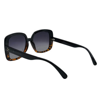 Sunglasses with black frame and tortoiseshell accents on a white background