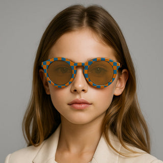Child wearing a stylish sunglasses with a neutral background
