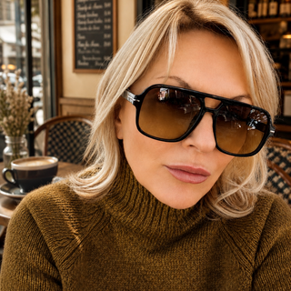 lady wearing aviator sunglasses in cafe