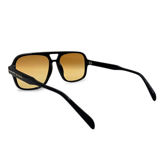 Black sunglasses with gold-tinted lenses on a white background