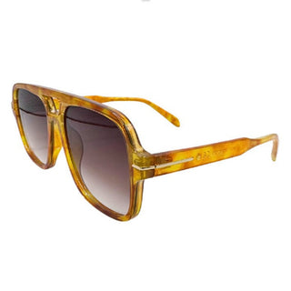 Golden brown sunglasses with a gradient lens on a white background