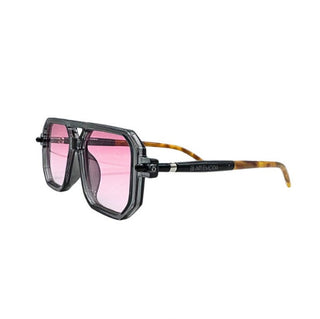 Sunglasses with pink lenses and tortoiseshell frame on a white background