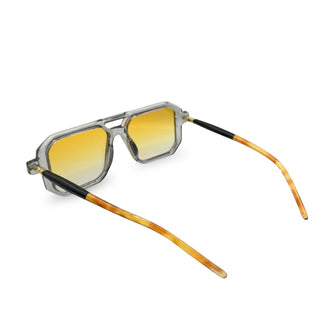 Sunglasses with yellow gradient lenses and black and orange frame on a white background