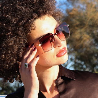 woman wearing oversized sunglasses