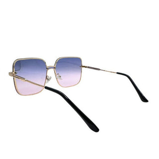 Sunglasses with gradient lenses and gold arms on a white background