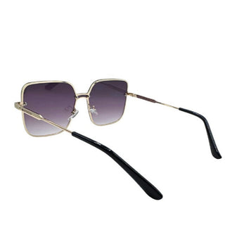 Sunglasses with gold frame and shaded lenses