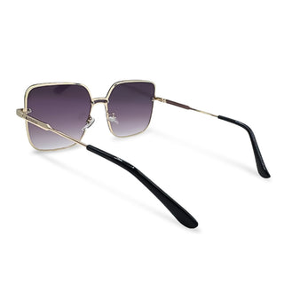 Sunglasses with gold frame and black arms on a white background