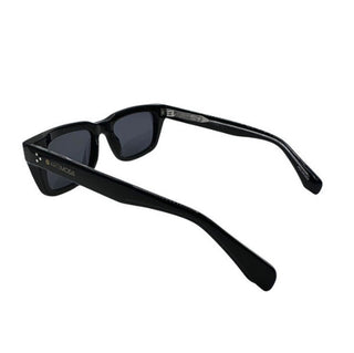 Black sunglasses with a brand logo on a white background