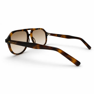 A pair of Artemoda sunglasses with a classic double-bridge aviator frame in a brown and black tortoiseshell pattern, featuring light brown gradient lenses.