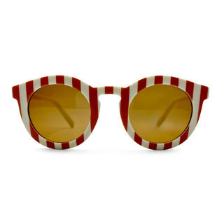 Sunglasses with red and white striped frame and yellow lenses on a white background