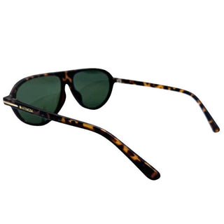 Sunglasses with tortoiseshell frame and dark lenses on a white background