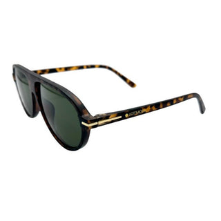 Sunglasses with tortoiseshell frame and green lenses on a white background