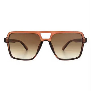 Brown sunglasses with a gradient lens on a white background