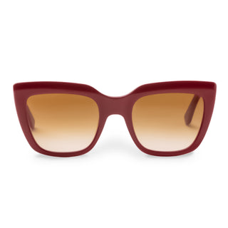 Red sunglasses with brown gradient lenses on a white background